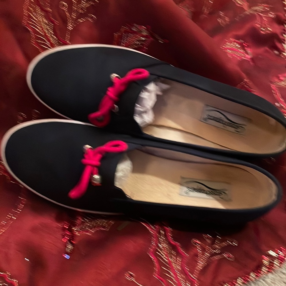 Like new; worn once.  Canvas slip on shoes